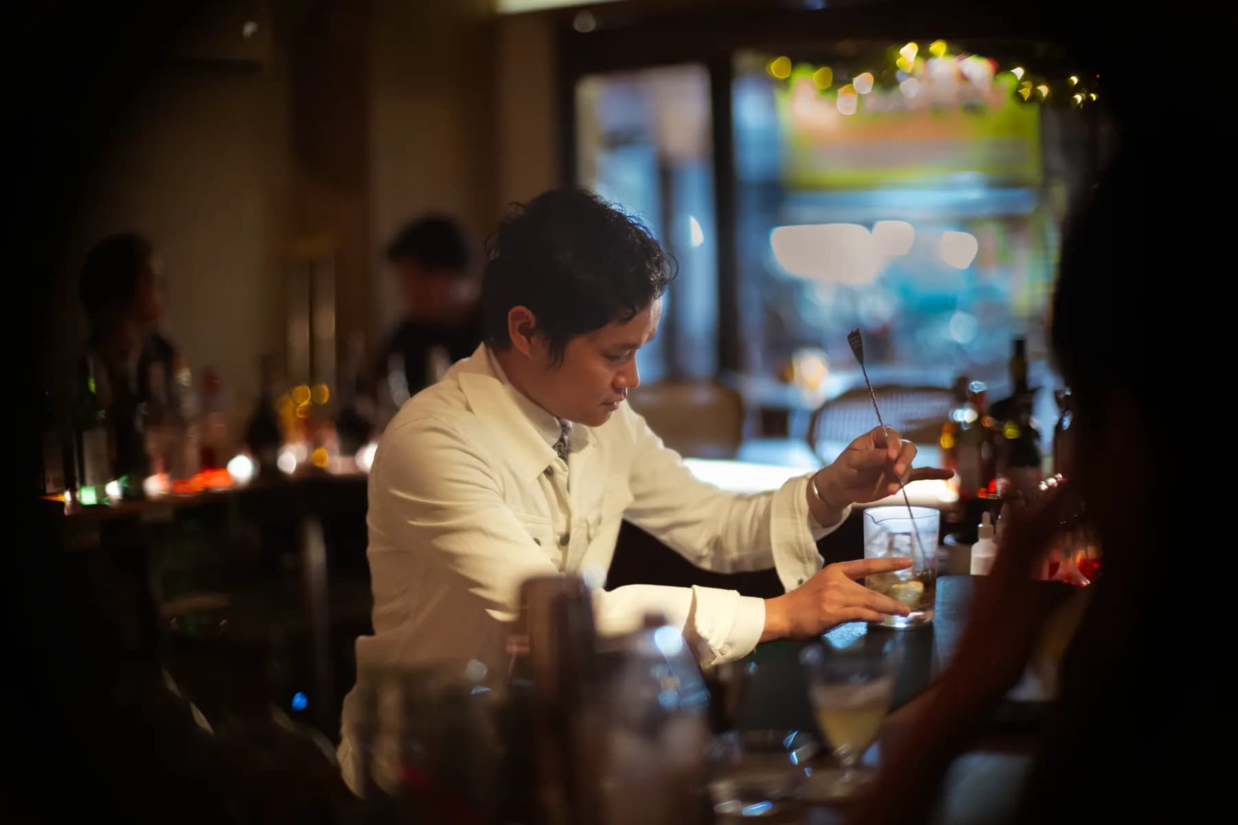 Bartender stirring a drink