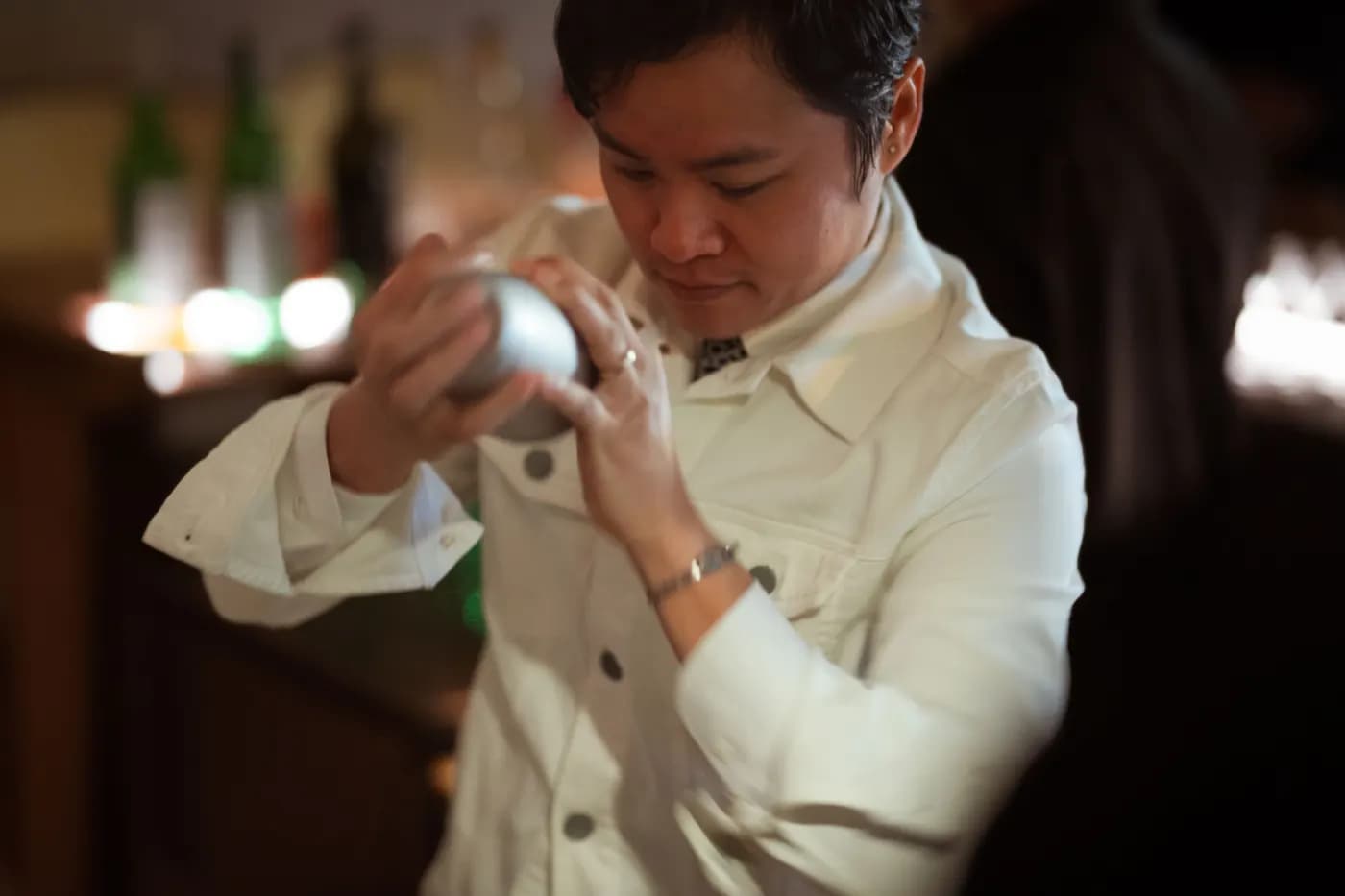 Bartender shaking a cocktail